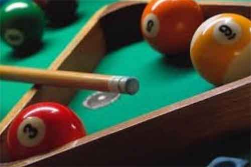 Racking up the balls on a pool table
